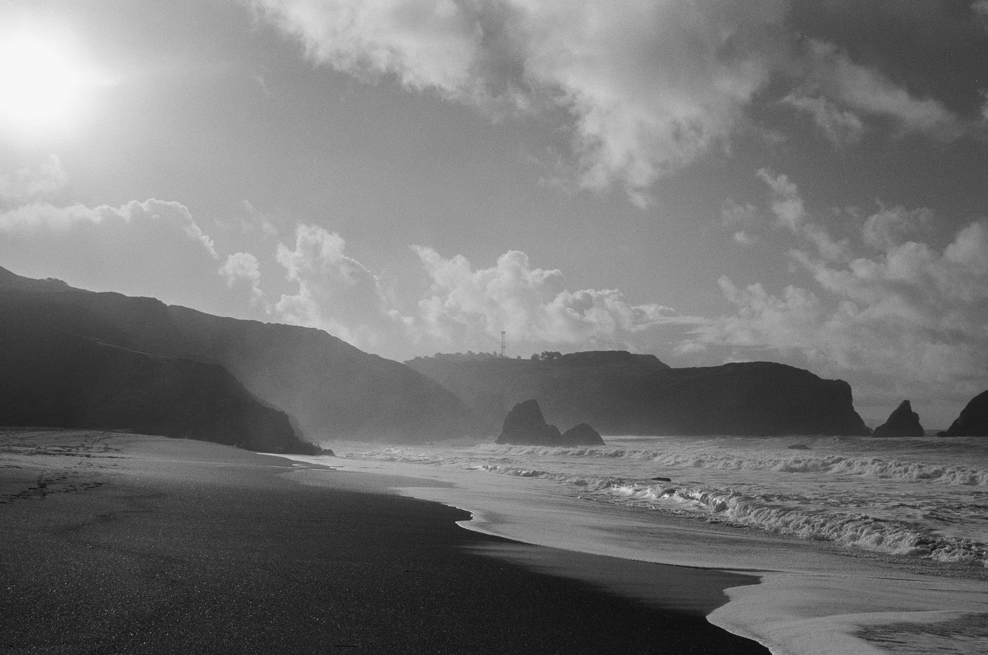 Black and white clouds over a San Francisco beach.